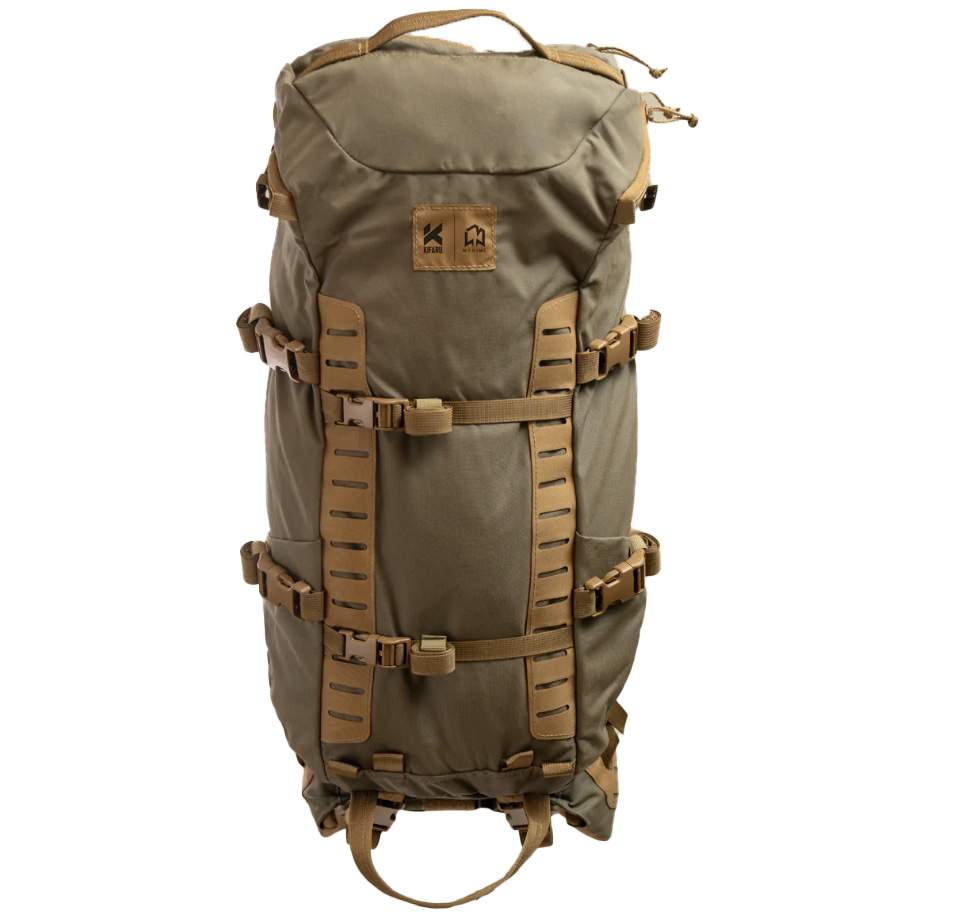 KIFAU MANIML The KIFAU MANIML is a highly adaptable daypack designed in collaboration with Levi Morgan and Kifaru, engineered specifically to complement the ARK Frame. Its dual access zippered lid allows effortless gear retrieval from either the inside or outside, whether the top is open or closed — perfect for quick access while perched in a tree or navigating rugged terrain. The pack’s full-length load sling and pleated load shelf keep your gear stable and balanced throughout your adventure. With laser-cut MOLLE webbing on the front, the MANIML provides extensive modularity for customizing your external loadout with belt pouches, holsters, or other mission-critical accessories. Both sides feature four-way stretch pockets secured with compression straps, ideal for carrying water bottles, spotting scopes, or tripods. The sewn-in compression straps on the front enable secure attachment of weapons or tree stands, ensuring everything stays in place when you need it most. Built with versatility in mind, the MANIML’s side compression straps include Three-bar Sliders for quick attachment to the ARK frame and come with a K-clip strap kit for compatibility with Duplex and Newplex frames. Weighing just 3.65 pounds with a total volume of 2,950 cubic inches (2200 + 750), this pack strikes the perfect balance between capacity, comfort, and accessibility. — Specs and Features: Dual access zippered lid for inside/outside gear retrieval Full-length load sling with pleated load shelf for load stability Cinch converts pack to daypack mode for versatility Laser-cut MOLLE webbing for customizable external attachments Four-way stretch side pockets with compression straps Bladder sleeve with dual hose ports on back panel Sewn-in .75” compression straps with autolocking buckles for gear/security Three-bar Slider side compression straps for ARK frame compatibility K-clip strap kit included for Duplex and Newplex frame attachments Volume: 2200 + 750 cubic inches Weight: 3.65 lbs — Notes: Designed in collaboration with Levi Morgan for optimal daypack performance Compatible with multiple frame systems (ARK, Duplex, Newplex) Ideal for hunters and outdoor enthusiasts needing quick gear access and modular storage — Whether you’re scaling mountains or hunting from a tree stand, the MANIML offers unmatched accessibility, modularity, and comfort to keep your gear exactly where you need it — right at your fingertips.