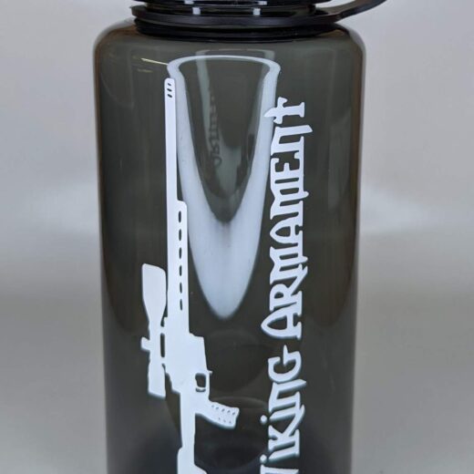 VA 32oz Water Bottle Durable | Leak-Resistant | Everyday Ready The Water Bottle is built to keep up with your daily grind, backcountry adventures, and range days alike. Crafted from tough, BPA-free plastic, this bottle is designed to handle impact and resist wear no matter where your mission takes you. The wide-mouth opening makes it easy to fill, clean, and mix in your favorite hydration additives. With a leak-resistant screw-on lid and durable loop-top design, it’s perfect for tossing into your pack or clipping to your gear with confidence. The slim profile fits most backpack pockets and cup holders, making it a reliable companion whether you’re chasing elevation or punching paper at the range. Finished in a smoked translucent color with the Viking Armament logo, it’s a subtle nod to those who live the forged life—on the move, with purpose. Components: BPA-free durable plastic bottle Wide-mouth design for easy filling and cleaning Leak-resistant screw-on lid Integrated carry loop Smoked translucent finish with Viking Armament branding Notes: Not designed for hot liquids Hand wash recommended to preserve graphics Fits most standard-size backpack bottle pockets Stay hydrated with a bottle that’s built for battle-tested days and backwoods treks. The VA Water Bottle is the no-fuss, field-proven essential for warriors who carry their gear with purpose.