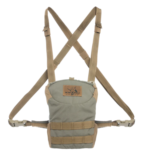 Deluxe Kifaru Bino Harness – Size M The Deluxe Kifaru Bino Harness (Size M) is built for hunters and outdoorsmen who demand comfort, durability, and quick access to their optics. Designed with the rugged functionality Kifaru is known for, this bino harness keeps your binoculars protected, secure, and ready at a moment’s notice. Whether you’re glassing distant ridgelines, stalking through heavy timber, or hiking deep into the backcountry, this harness is engineered to perform in the toughest conditions. Key Features & Benefits Low-Profile Design – Streamlined and snug fit keeps your optics tight to your chest, reducing bounce and movement during active hunts. Magnetic One-Handed Access – Silent magnetic closure allows you to quickly deploy or stow your binoculars without fumbling or making unnecessary noise. Durable Construction – Built from heavy-duty, weather-resistant materials that withstand brush, rain, and dust. Adjustable Fit – Harness system distributes weight evenly across your shoulders, reducing fatigue during long days in the field. Size Medium Compatibility – Designed to fit a wide range of popular binocular models in the medium size range. Extra Storage Options – Side and front pockets provide space for small essentials like wind checkers, calls, rangefinders, or a lens cloth. Built for the Backcountry Unlike bulky or noisy alternatives, the Kifaru Deluxe Bino Harness emphasizes stealth and practicality. Its slim design makes it easy to wear with a backpack, while still offering complete protection for your glass. The harness eliminates the hassle of swinging neck straps and keeps your binoculars dust-free, dry, and immediately accessible. Size & Fit Model: Deluxe Harness – Medium Fits: Most mid-sized binoculars (8x42, 10x42, and similar profiles). Why Choose Kifaru? Kifaru has earned a reputation among serious hunters for building gear that lasts a lifetime in the field. With the Deluxe Bino Harness (M), you’re getting a piece of kit designed for reliability, comfort, and performance when it matters most.
