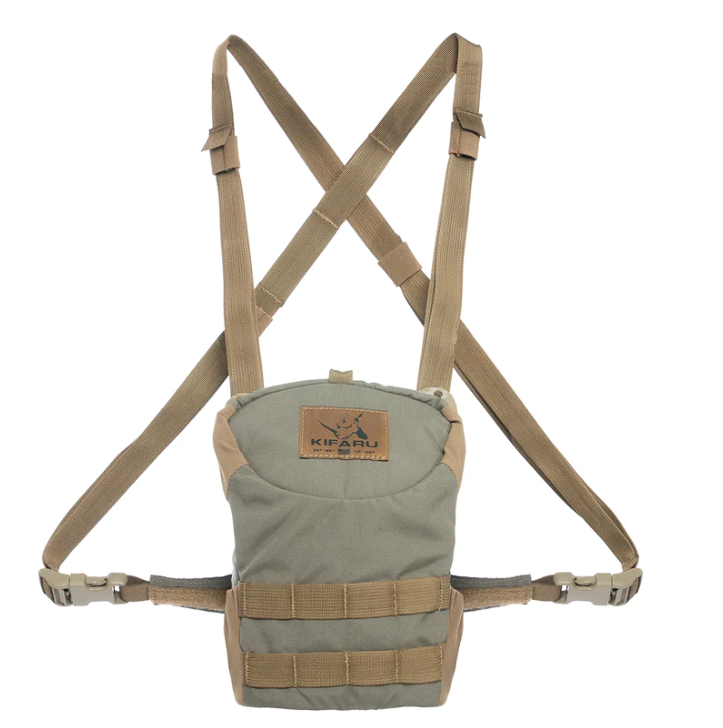 Deluxe Kifaru Bino Harness – Size M The Deluxe Kifaru Bino Harness (Size M) is built for hunters and outdoorsmen who demand comfort, durability, and quick access to their optics. Designed with the rugged functionality Kifaru is known for, this bino harness keeps your binoculars protected, secure, and ready at a moment’s notice. Whether you’re glassing distant ridgelines, stalking through heavy timber, or hiking deep into the backcountry, this harness is engineered to perform in the toughest conditions. Key Features & Benefits Low-Profile Design – Streamlined and snug fit keeps your optics tight to your chest, reducing bounce and movement during active hunts. Magnetic One-Handed Access – Silent magnetic closure allows you to quickly deploy or stow your binoculars without fumbling or making unnecessary noise. Durable Construction – Built from heavy-duty, weather-resistant materials that withstand brush, rain, and dust. Adjustable Fit – Harness system distributes weight evenly across your shoulders, reducing fatigue during long days in the field. Size Medium Compatibility – Designed to fit a wide range of popular binocular models in the medium size range. Extra Storage Options – Side and front pockets provide space for small essentials like wind checkers, calls, rangefinders, or a lens cloth. Built for the Backcountry Unlike bulky or noisy alternatives, the Kifaru Deluxe Bino Harness emphasizes stealth and practicality. Its slim design makes it easy to wear with a backpack, while still offering complete protection for your glass. The harness eliminates the hassle of swinging neck straps and keeps your binoculars dust-free, dry, and immediately accessible. Size & Fit Model: Deluxe Harness – Medium Fits: Most mid-sized binoculars (8x42, 10x42, and similar profiles). Why Choose Kifaru? Kifaru has earned a reputation among serious hunters for building gear that lasts a lifetime in the field. With the Deluxe Bino Harness (M), you’re getting a piece of kit designed for reliability, comfort, and performance when it matters most.