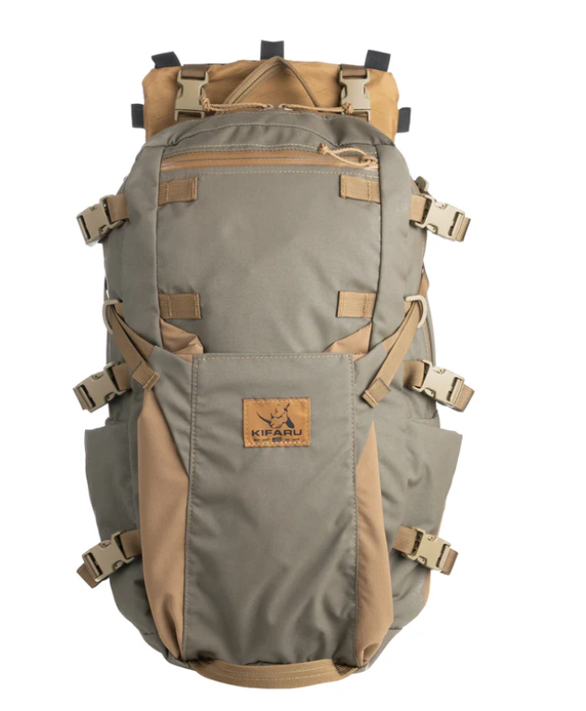 Kifaru Hellbender The Hellbender builds upon the evolution of the Stryker series, offering the perfect balance of compact design and increased storage for day hunts, mobile pursuits, or short expeditions. With its 2,250 cubic inch capacity and thoughtful external organization, the Hellbender is purpose-built to keep your essential gear close and ready while maximizing pack-out capability. Designed with feedback from hunters and backcountry users, the Hellbender adds 350 cubic inches over the Stryker XL and introduces a Bane-style external pocket ideal for wet layers, rain gear, or bulky insulation. The XPAC load sling makes cleanup after a successful hunt much easier, while side bottle pockets and an internal bladder sleeve ensure hydration is always accessible. Compression straps can be repositioned to help secure optics and fragile gear, and internal organization is handled with a Chamber pocket, hydration sleeve, and external admin panel. Compatible with Kifaru’s external frames, the Hellbender is an ultra-adaptable hauler for those looking to travel fast, light, and efficiently in challenging terrain. Specs and Features: External frame required Includes outer Bane-style pocket XPAC load sling for easy cleaning Dual Nalgene side pockets Chamber pocket and internal bladder sleeve Belt pouch matrix and zippered admin pocket Volume: 2250 Cubic Inches (36.87L) Weight: 3.05 lb Notes: Webbing on bottom accommodates Sherman and Grab-it pockets Hydration hose ports on both sides of top handle Includes all necessary compression straps Whether you're on a minimalist elk hunt or quick strike backcountry mission, the Hellbender gives you the capacity, features, and rugged build Kifaru is known for — without unnecessary bulk.