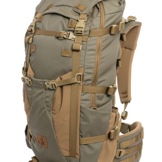 Kifaru Bedlam – Versatility, Access, and Loadout Efficiency The Kifaru Bedlam expands on the heritage of the Hoodlum and Hellbender, bringing together their best elements in a 3–4-day Duplex-compatible pack built for backcountry flexibility and access. Crafted from 500D Ranger Green Cordura with Coyote Brown 4-way stretch Tweave fabric and durable #8 YKK zippers, the Bedlam is made to handle tough conditions and dynamic hunts. With full-zip access and an asymmetrical pocket layout, you get fast, intuitive organization and the ability to grab your gear exactly when you need it. The left-side spotting scope pocket can accommodate items up to 20” tall, 9” wide, and 4” deep, secured by a single #8 zipper and multiple compression straps. On the right, a reinforced Tweave water bottle pocket fits two 32oz Nalgenes and secures tripods or similar items with an over-pocket strap. The main zip opens 2/3 of the way around the bag, allowing you to load from a stable bucket position and rapidly access contents from the top via reinforced pull loops. A Hellbender-style front pocket easily stores outer layers, snowshoes, wet items, or a folded chassis rifle, while ¾” webbing straps allow compression routing around bulky loads or weapon systems. The bottom handle supports carrying bow cams or tools like ice axes, and bottom-mounted K-clip straps are perfect for tents or sleeping pads. Dual hydration exits, an internal bladder sleeve, and a removable Chamber Pocket keep essentials close and hydration dialed. Components: 500D Ranger Green Cordura + 4-way stretch Tweave Asymmetrical zippered layout with full-zip side access Spotting scope pocket, water bottle pouch, front gear pocket Compatible with all Kifaru lids, Sherman Pocket, and Grabit Includes Chamber Pocket, K-clip straps, and hydration routing Duraflex Autolock buckles and Duplex frame compatible Notes: Designed for 3–4-day missions Ideal for gear-heavy hunts or extended scouting Built in the USA for maximum durability and modularity The Bedlam is built to maximize access and carry capability—perfect for the hunter who needs one pack to do it all.