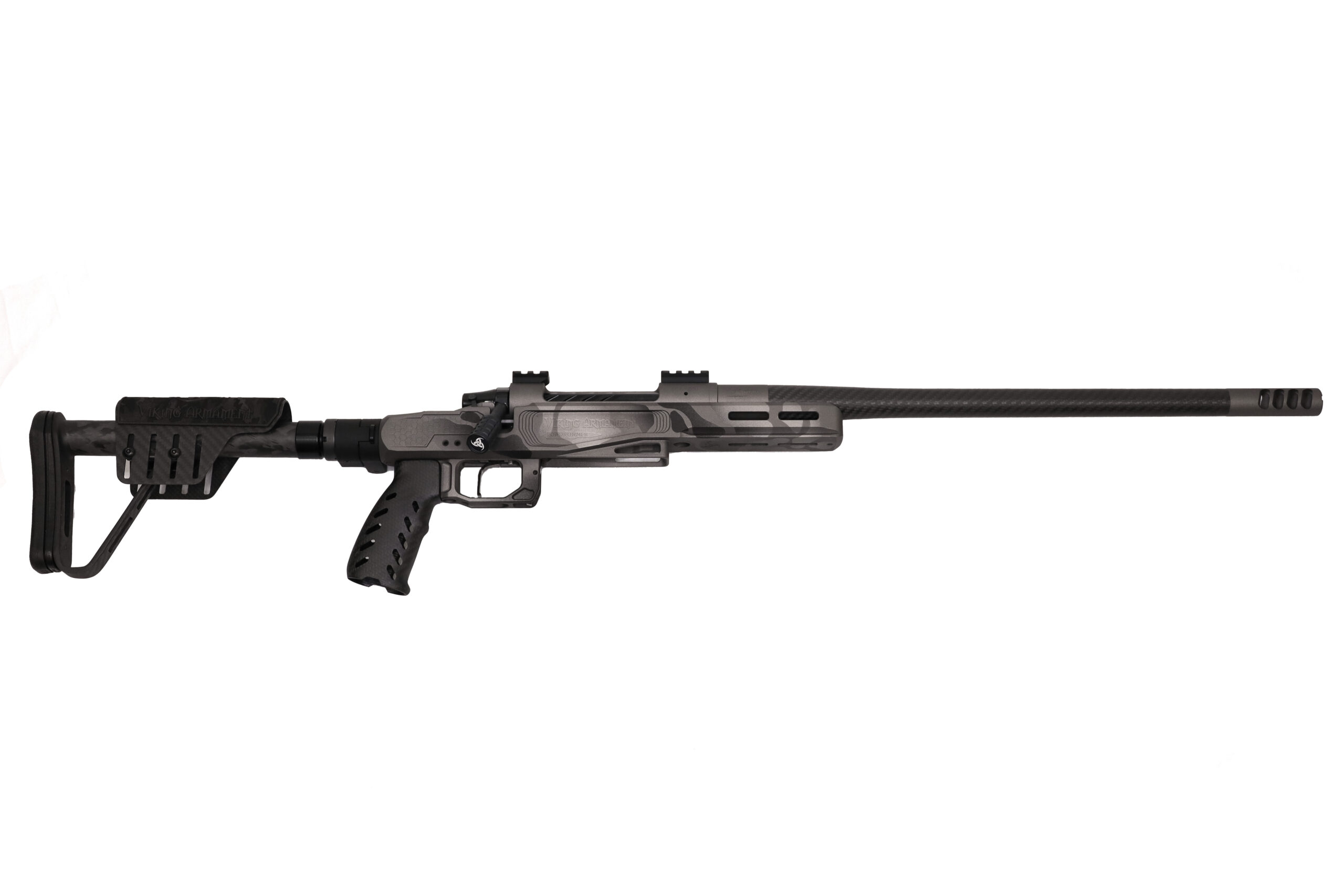 VA Road Runner – 7 Backcountry (Urban Safari) Ultralight Precision Rifle | Ready to Ship When every ounce matters and precision is non-negotiable, the VA Road Runner 7 Backcountry in Urban Safari delivers on all fronts. Built for the dedicated hunter and long-range shooter who demands the perfect blend of performance and packability, this ultralight rifle is engineered to thrive in the harshest environments. At the core of this build is the Viking Armament Outlaw stainless action paired with an 18” Benchmark Carbon Sendero barrel, chambered in our proprietary 7 Backcountry cartridge. Whether navigating steep terrain or crossing wide-open basins, this short-barrel configuration offers reduced weight and improved maneuverability without sacrificing long-range performance. The MB&M 4 Port Muzzle Brake is perfectly timed to the barrel, mitigating recoil and enhancing control for fast, accurate follow-up shots. Housed in our VA Road Runner Magnesium Chassis, this rifle features high-strength carbon components and an integrated folding adapter—allowing it to collapse into a compact, carry-ready platform ideal for remote excursions. The Trigger Tech Special Flat Bar trigger in black offers a crisp, consistent break for ultimate control in the field. Finished in our hand-applied Urban Safari Cerakote with a Tungsten bolt assembly, this rifle not only performs in rugged terrain but looks the part—built to blend into arid landscapes and rocky alpine outcrops. Specifications: Viking Armament Outlaw Stainless Action 18” Benchmark Carbon Barrel (Sendero Contour) MB&M 4 Port Gunsmith-Timed Muzzle Brake Trigger Tech Special Flat Bar Trigger (Black) VA Road Runner Magnesium Chassis w/ Folding Adapter Carbon Fiber Grip, Cheek Rest & Buttstock Urban Safari Cerakote with Tungsten Bolt Assembly Sub ½ MOA Guarantee. 100% Made in the USA. Limited Lifetime Warranty Included. Lead Time: Ready to Ship