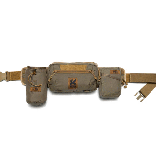 Kifaru Rogan Run-N-Gun Belt The Kifaru Rogan Run-N-Gun Belt is built for speed, mobility, and versatility when you need to move fast without sacrificing load-bearing comfort. Designed with hunters, tactical users, and backcountry shooters in mind, this minimalist belt combines Kifaru’s legendary durability with a streamlined profile that won’t slow you down. Whether you’re chasing game through rugged terrain, setting up for a quick stalk, or carrying the essentials on a training range, the Rogan Run-N-Gun Belt delivers a secure, customizable foundation for your gear. Key Features Low-Profile Design – Streamlined build for maximum mobility without excess bulk. Premium Construction – Made from durable, abrasion-resistant materials that withstand heavy use. Modular Compatibility – Accepts MOLLE accessories and pouches for fully customizable loadouts. Comfort Fit – Ergonomic structure balances weight for extended wear. Secure Closure System – Stays locked in during dynamic movement and heavy exertion. Why It Stands Out The Rogan Run-N-Gun Belt is designed for users who need to move fast and stay light. It eliminates unnecessary weight while still offering a rock-solid platform for critical gear. Unlike standard belts that slip or sag under pressure, Kifaru’s design integrates stiff yet comfortable support, ensuring holsters, ammo pouches, or hunting essentials remain exactly where you need them. This makes it a top choice for fast-paced hunting scenarios, range work, or anyone who values freedom of movement without compromising functionality. Specs Material: High-strength, abrasion-resistant webbing & hardware Modularity: MOLLE-compatible for accessories and pouches Fit Options: Available in multiple sizes for a custom fit Made in the USA The Kifaru Rogan Run-N-Gun Belt is the perfect blend of speed and support — giving you the freedom to move, the strength to carry, and the reliability to trust in any fast-action environment.