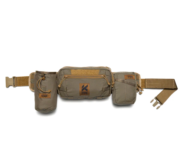 Kifaru Rogan Run-N-Gun Belt The Kifaru Rogan Run-N-Gun Belt is built for speed, mobility, and versatility when you need to move fast without sacrificing load-bearing comfort. Designed with hunters, tactical users, and backcountry shooters in mind, this minimalist belt combines Kifaru’s legendary durability with a streamlined profile that won’t slow you down. Whether you’re chasing game through rugged terrain, setting up for a quick stalk, or carrying the essentials on a training range, the Rogan Run-N-Gun Belt delivers a secure, customizable foundation for your gear. Key Features Low-Profile Design – Streamlined build for maximum mobility without excess bulk. Premium Construction – Made from durable, abrasion-resistant materials that withstand heavy use. Modular Compatibility – Accepts MOLLE accessories and pouches for fully customizable loadouts. Comfort Fit – Ergonomic structure balances weight for extended wear. Secure Closure System – Stays locked in during dynamic movement and heavy exertion. Why It Stands Out The Rogan Run-N-Gun Belt is designed for users who need to move fast and stay light. It eliminates unnecessary weight while still offering a rock-solid platform for critical gear. Unlike standard belts that slip or sag under pressure, Kifaru’s design integrates stiff yet comfortable support, ensuring holsters, ammo pouches, or hunting essentials remain exactly where you need them. This makes it a top choice for fast-paced hunting scenarios, range work, or anyone who values freedom of movement without compromising functionality. Specs Material: High-strength, abrasion-resistant webbing & hardware Modularity: MOLLE-compatible for accessories and pouches Fit Options: Available in multiple sizes for a custom fit Made in the USA The Kifaru Rogan Run-N-Gun Belt is the perfect blend of speed and support — giving you the freedom to move, the strength to carry, and the reliability to trust in any fast-action environment.