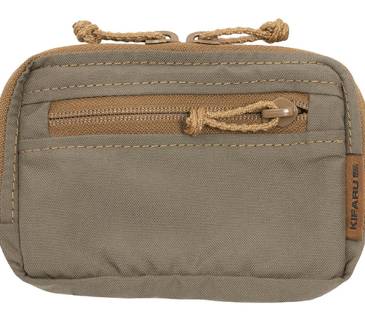 Kifaru Admin Pouch The Kifaru Admin Pouch is a purpose-built organizer designed to keep your small gear, tools, and documents neatly arranged and quickly accessible. Engineered with Kifaru’s signature durability, this pouch is equally at home on the range, in the field, or as part of your everyday carry system. Constructed from heavy-duty, abrasion-resistant materials, the Admin Pouch is built to handle rugged environments without sacrificing organization. Its compact profile provides a surprising amount of storage space, with dedicated compartments and internal organization features that ensure your gear stays secure and accessible. From multitools and notebooks to navigation aids, small electronics, or essential field gear, the Admin Pouch keeps everything right where you need it. Key Features Efficient Organization – Multiple compartments and dividers for easy gear management. Durable Construction – Built from high-quality, abrasion-resistant fabric for long-lasting use. Streamlined Profile – Compact design adds utility without unnecessary bulk. Versatile Carry Options – Mounts to belts, packs, or other MOLLE-compatible platforms. Multi-Environment Use – Perfect for field operations, hunting, range use, or everyday carry. Why It Stands Out The Kifaru Admin Pouch is more than just extra storage—it’s the solution for keeping your mission-critical items organized and accessible. Whether you’re navigating backcountry terrain, managing gear at the range, or simply keeping your essentials close on a day hike, the Admin Pouch provides the efficiency and durability you can trust in the toughest conditions. Specs Material: Heavy-duty, abrasion-resistant fabric Compartments: Multiple interior sections for organization Attachment: Compatible with belts, packs, and MOLLE systems Use Cases: Hunting, tactical, range, field, EDC