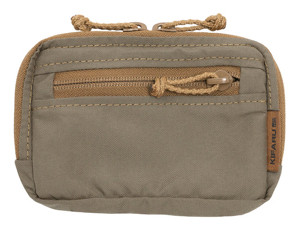 Kifaru Admin Pouch The Kifaru Admin Pouch is a purpose-built organizer designed to keep your small gear, tools, and documents neatly arranged and quickly accessible. Engineered with Kifaru’s signature durability, this pouch is equally at home on the range, in the field, or as part of your everyday carry system. Constructed from heavy-duty, abrasion-resistant materials, the Admin Pouch is built to handle rugged environments without sacrificing organization. Its compact profile provides a surprising amount of storage space, with dedicated compartments and internal organization features that ensure your gear stays secure and accessible. From multitools and notebooks to navigation aids, small electronics, or essential field gear, the Admin Pouch keeps everything right where you need it. Key Features Efficient Organization – Multiple compartments and dividers for easy gear management. Durable Construction – Built from high-quality, abrasion-resistant fabric for long-lasting use. Streamlined Profile – Compact design adds utility without unnecessary bulk. Versatile Carry Options – Mounts to belts, packs, or other MOLLE-compatible platforms. Multi-Environment Use – Perfect for field operations, hunting, range use, or everyday carry. Why It Stands Out The Kifaru Admin Pouch is more than just extra storage—it’s the solution for keeping your mission-critical items organized and accessible. Whether you’re navigating backcountry terrain, managing gear at the range, or simply keeping your essentials close on a day hike, the Admin Pouch provides the efficiency and durability you can trust in the toughest conditions. Specs Material: Heavy-duty, abrasion-resistant fabric Compartments: Multiple interior sections for organization Attachment: Compatible with belts, packs, and MOLLE systems Use Cases: Hunting, tactical, range, field, EDC