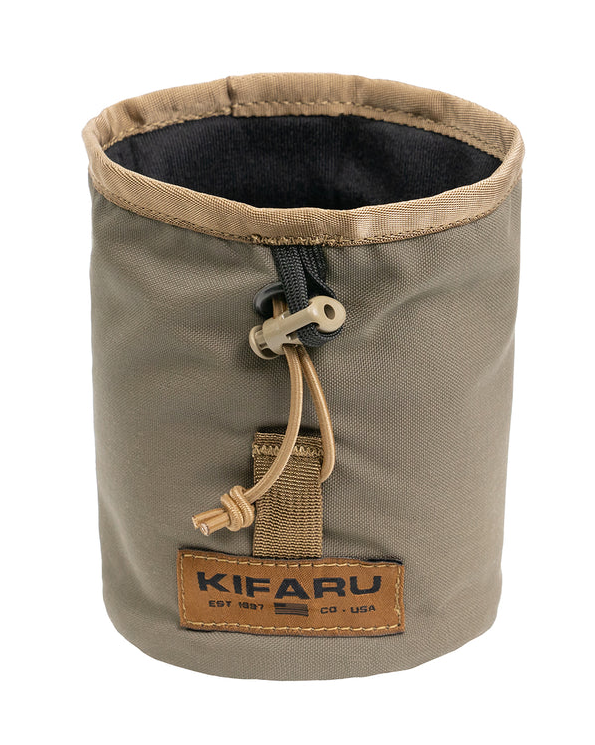 Kifaru Release Pouch The Kifaru Release Pouch is a streamlined, quick-access storage solution designed for fast deployment of essential gear. Built with Kifaru’s legendary durability and attention to detail, this pouch excels in situations where speed, reliability, and ruggedness matter most. Crafted from abrasion-resistant, high-strength materials, the Release Pouch is designed to withstand the toughest environments without compromising accessibility. Its innovative pull-tab opening system allows you to rapidly deploy the pouch’s contents, making it ideal for items you need in a hurry—such as medical supplies, navigation tools, or other mission-critical gear. Its compact size and modular design allow it to be easily mounted on belts, packs, or MOLLE-compatible platforms, ensuring it integrates seamlessly with your existing kit. Whether you’re deep in the backcountry, on the range, or in tactical environments, the Release Pouch offers the perfect balance of rugged construction and instant accessibility. Key Features Quick-Access Design – Pull-tab release system for rapid deployment of contents. Heavy-Duty Construction – Built from abrasion-resistant materials to endure field use. Compact & Streamlined – Slim profile adds utility without unnecessary bulk. Modular Integration – Attaches easily to belts, packs, or MOLLE-compatible platforms. Field-Ready Functionality – Perfect for medical kits, navigation tools, or other essentials. Why It Stands Out The Kifaru Release Pouch isn’t just about storage—it’s about speed and dependability. When every second matters, this pouch ensures your gear is exactly where you need it and ready to deploy instantly. From hunting and backcountry travel to tactical operations, the Release Pouch is built to deliver when it counts. Specs Material: Heavy-duty, abrasion-resistant fabric Opening System: Quick-release pull-tab Attachment: MOLLE and belt compatible Use Cases: Medical gear, navigation tools, tactical essentials, hunting