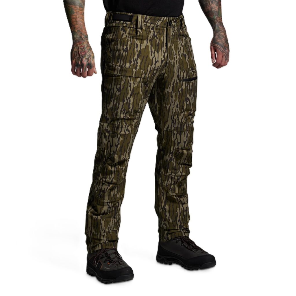 Men’s Frontier Pant 2.0 – Mossy Oak Built for serious backcountry hunters and outdoor professionals, the Frontier Pant 2.0 delivers a perfect balance of durability, comfort, and versatility. Designed to thrive in demanding environments, these pants are engineered to perform across a wide range of conditions—comfortable in 60°F weather but tough enough to handle frigid extremes when paired with a proper layering system. Constructed from a 4-way stretch fabric, the Frontier 2.0 moves with you rather than against you, ensuring unrestricted mobility when climbing ridges, crawling through brush, or kneeling for a shot. The fabric is warm yet breathable, with side-zip vents that allow you to regulate body temperature during high-exertion hunts. To enhance performance in wet or rugged terrain, the pants are finished with a durable water-repellent coating and reinforced in critical high-wear zones: the knees, seat, and heels. For extended backcountry use, the Frontier Pant 2.0 incorporates internal knee pad pockets for added protection and comfort during long glassing sessions or stalks. The pocket system is designed with hunters in mind—providing ample, versatile storage without bulk, keeping essential gear close at hand without hindering movement. Fit and comfort are equally prioritized. The athletic cut is dialed in for active hunters who demand flexibility without sacrificing durability. Whether you’re navigating rocky terrain, trekking through snow, or waiting out long hours in the stand, these pants are engineered to adapt with you. Key Features 4-way stretch fabric for mobility and durability Water-repellent finish for all-weather performance Reinforced knees, seat, and heel for longevity Side-zip vents for temperature regulation Internal knee pad pockets for added comfort Athletic fit with versatile pocket system Conditions: 60°F to Frigid