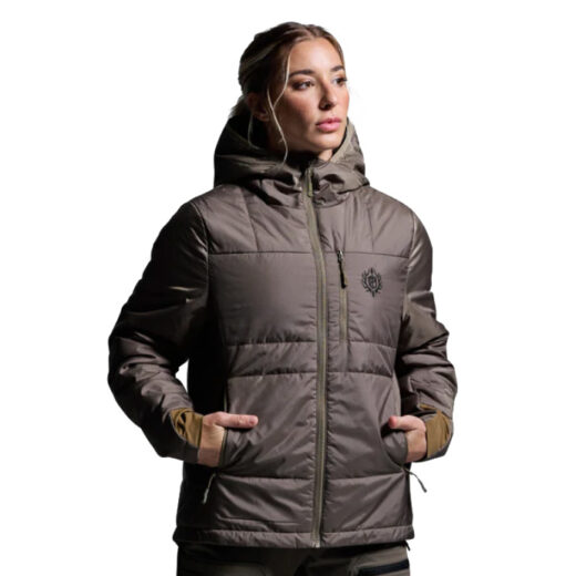 Women’s Tundra Jacket Light 2.0 The Women’s Tundra Jacket Light 2.0 is engineered for backcountry hunters and outdoor enthusiasts who demand warmth without sacrificing packability. Built with the same advanced synthetic insulation found in the full Tundra 2.0, this lighter version is designed for those who value efficiency and versatility in their layering system. It delivers dependable thermal performance in cold conditions, while its streamlined profile ensures unrestricted movement during active pursuits. One of the defining features of the Tundra Light 2.0 is its self-stowing design, allowing the jacket to pack neatly into its own pocket. This makes it an ideal option for long treks, backcountry hunts, or travel when every cubic inch of pack space matters. Despite its lightweight build, it offers reliable weather resistance with a durable shell and breathable construction, keeping you comfortable during changing activity levels and conditions. The cut of the Tundra Light 2.0 is tailored specifically for women, offering an athletic fit that layers comfortably without bulk while maintaining a flattering silhouette. Whether worn as a standalone outer layer in cool weather or paired with additional insulation in frigid conditions, this jacket adapts seamlessly to your needs. Built for performance, the Tundra Light 2.0 features strategically placed insulation to maximize warmth retention while still allowing for excellent mobility. It resists moisture, dries quickly, and continues to insulate even when damp—ensuring consistent comfort and reliability in unpredictable climates. Key Features: Lightweight Synthetic Insulation – Reliable warmth without bulk. Self-Stowing Design – Compresses into its own pocket for compact storage. Breathable, Weather-Resistant Shell – Durable and versatile for varied conditions. Women’s-Specific Fit – Streamlined, functional, and comfortable. Recommended Conditions: 40°F to Frigid – Worn alone in cool weather or layered for harsh cold. The Women’s Tundra Jacket Light 2.0 is the perfect balance of packability, performance, and all-weather protection—making it a must-have piece for serious backcountry adventurers.