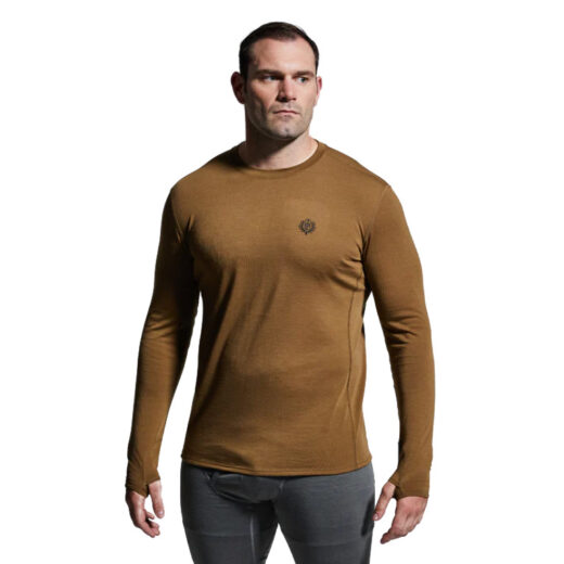 Men’s Ridgeline Base Layer Top The Ridgeline Base Layer Top is your go-to foundation for cold-weather performance. Designed to sit next-to-skin, this premium base layer combines comfort, moisture control, and warmth to keep you moving efficiently in demanding conditions. Crafted from a super-soft Merino wool blend, the Ridgeline Base Layer wicks moisture, dries quickly, and regulates body temperature—even during high levels of exertion. Naturally anti-microbial, Merino resists odor buildup while maintaining insulation, even when wet. This makes it the perfect layer for multi-day hunts, extended field missions, or long backcountry expeditions where performance and reliability matter most. For even harsher conditions, a heavier version (Ridgeline Top Heavy Base Layer) is available for extreme cold-weather pursuits. Key Features: Merino Wool Blend – Soft, breathable, moisture-wicking, and quick-drying. Anti-Microbial Properties – Naturally resists odor for extended wear. Retains Insulation When Wet – Keeps you warm even in damp conditions. Athletic Next-to-Skin Fit – Ideal as a foundation for layering systems. Lightweight & Versatile – Perfect for active cold-weather performance. Recommended Conditions: Cold to Frigid when paired with a mid-layer and/or outer layer. The Men’s Ridgeline Base Layer Top delivers the warmth, breathability, and comfort you need to perform in the field, making it a must-have for any serious layering system.