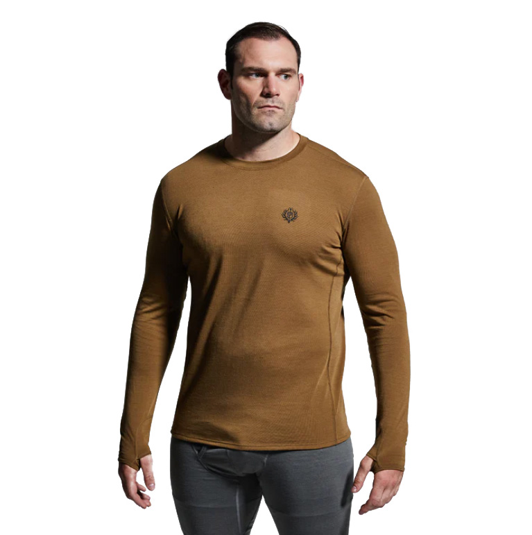 Men’s Ridgeline Base Layer Top The Ridgeline Base Layer Top is your go-to foundation for cold-weather performance. Designed to sit next-to-skin, this premium base layer combines comfort, moisture control, and warmth to keep you moving efficiently in demanding conditions. Crafted from a super-soft Merino wool blend, the Ridgeline Base Layer wicks moisture, dries quickly, and regulates body temperature—even during high levels of exertion. Naturally anti-microbial, Merino resists odor buildup while maintaining insulation, even when wet. This makes it the perfect layer for multi-day hunts, extended field missions, or long backcountry expeditions where performance and reliability matter most. For even harsher conditions, a heavier version (Ridgeline Top Heavy Base Layer) is available for extreme cold-weather pursuits. Key Features: Merino Wool Blend – Soft, breathable, moisture-wicking, and quick-drying. Anti-Microbial Properties – Naturally resists odor for extended wear. Retains Insulation When Wet – Keeps you warm even in damp conditions. Athletic Next-to-Skin Fit – Ideal as a foundation for layering systems. Lightweight & Versatile – Perfect for active cold-weather performance. Recommended Conditions: Cold to Frigid when paired with a mid-layer and/or outer layer. The Men’s Ridgeline Base Layer Top delivers the warmth, breathability, and comfort you need to perform in the field, making it a must-have for any serious layering system.