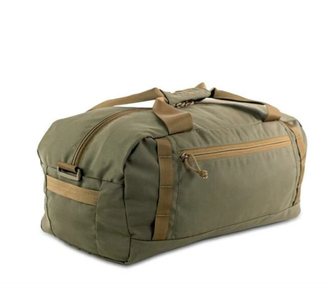 Kifaru Rampart Duffel The Kifaru Rampart Duffel is built for hunters, travelers, and gear-heavy adventurers who demand a rugged, dependable, and purpose-driven carry system. Designed with Kifaru’s legendary durability, the Rampart Duffel delivers an exceptional balance between strength, organization, and simplicity—making it the ideal choice for everything from backcountry expeditions to overland trips and everyday gear hauling. Constructed from ultra-durable, high-denier materials, the Rampart Duffel is built to withstand the abuse of rough travel, heavy loads, and unpredictable environments. Reinforced stitching, robust zippers, and premium hardware ensure this duffel can be dragged, tossed, and packed to its limits without compromising performance. Whether you’re loading it with hunting gear, clothing, emergency equipment, or tools, the Rampart is engineered to hold up year after year. One of the standout features of the Rampart Duffel is its intuitive layout. The main compartment offers generous space for larger items, while the internal pockets allow for easy organization of smaller essentials. The wide-mouth opening provides quick access, letting you pack and unpack with efficiency—perfect when time is tight or conditions are rough. External grab handles and reinforced carry straps give you multiple ways to haul the duffel, whether you're moving through airports, loading up the truck, or hauling it into camp. Versatility is at the core of the Rampart’s design. It’s lightweight enough for everyday use yet rugged enough for extended hunts and demanding travel scenarios. Whether used as a dedicated gear bag, a clothing duffel for multi-day hunts, or a reliable companion for road trips, it offers the level of toughness and utility Kifaru is known for. For anyone who needs a durable, high-capacity, no-nonsense duffel that thrives in harsh environments, the Kifaru Rampart Duffel is a dependable choice that won’t let you down—no matter where the journey takes you.
