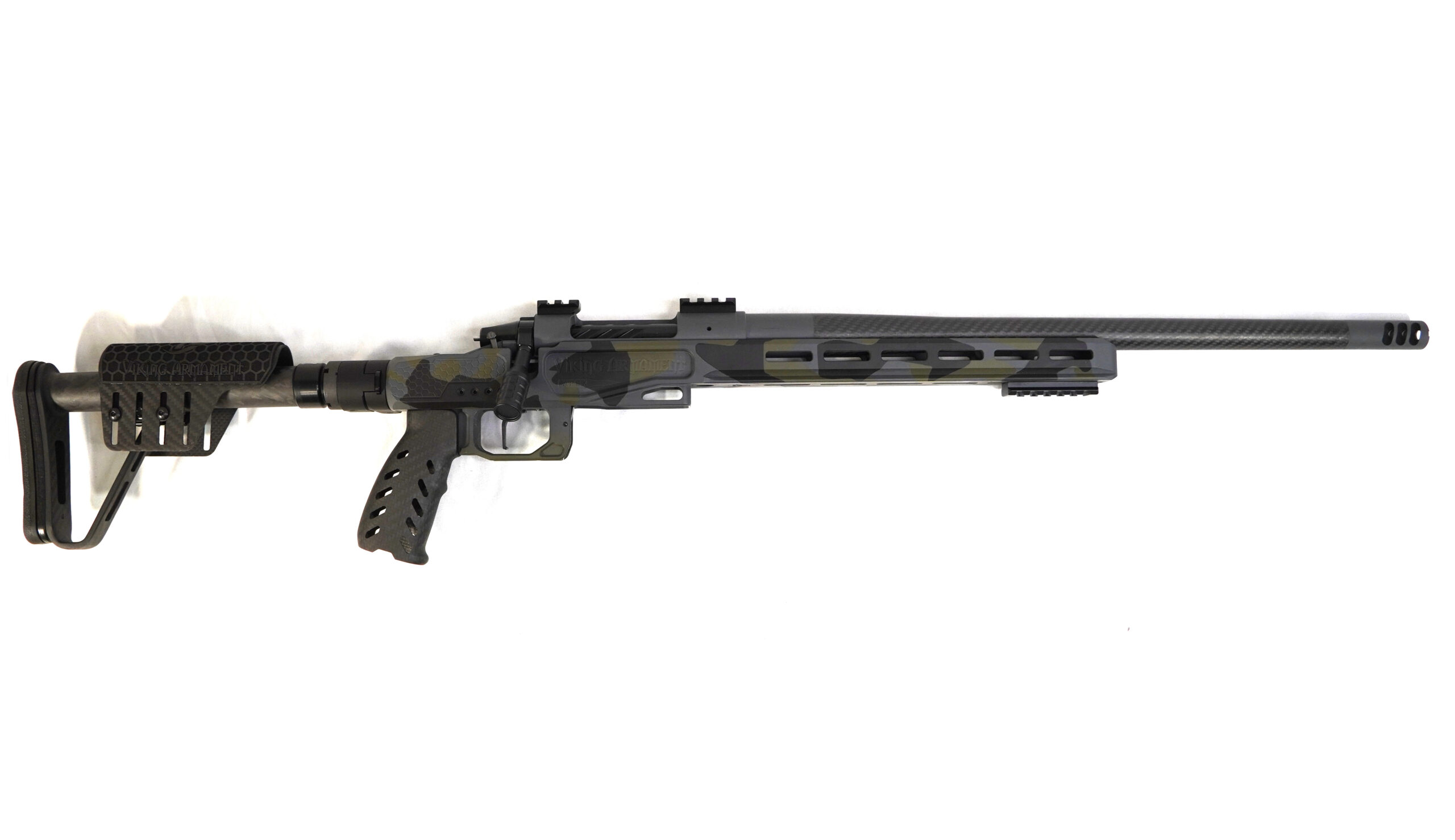 6.5 PRC CUSTOM BUILD (SPLINTER CAMO) Designed for hunters who demand lightweight performance and precision in the field, this 6.5 PRC custom build delivers a refined balance of mobility, durability, and long-range capability. Built around a carbon-forward platform and premium components, this rifle is optimized for backcountry hunts and extended-range shooting where consistency matters. Weighing just 6 lbs 11.4 oz, it offers excellent packability without sacrificing stability or control. Component Breakdown Action: Viking Armament Outlaw (VAOL) Chassis: Element 4.0 (Viking Armament Edition – Magnesium) Barrel: 20” Benchmark Barrel (6.5 PRC) Trigger: TriggerTech Special (TTS) Furniture: Carbon Fiber Components (Grip, Buttstock, Folding Adapter) Finish: Custom Cerakote (Black, Gray, Green Splinter Camo) Performance & Application The 6.5 PRC is known for its flat trajectory and efficient long-range performance, making it a go-to cartridge for hunters targeting medium to large game at distance. Paired with a 20” Benchmark barrel, this rifle delivers consistent velocity and excellent shot-to-shot reliability while maintaining a lightweight profile. The magnesium Element 4.0 chassis provides a rigid, stable shooting platform without excess weight, while the carbon fiber components further reduce carry fatigue during long hunts. This setup creates a rifle that is easy to transport, quick to deploy, and dependable in demanding environments. The TriggerTech Special offers a crisp, repeatable break, allowing for precise shot placement when it matters most. The custom splinter camo Cerakote finish adds a unique, aggressive look while providing long-lasting protection against the elements. Precision Guarantee Every Viking Armament rifle is backed by our Sub-½ MOA Accuracy Guarantee, ensuring consistent, reliable accuracy in every shot.