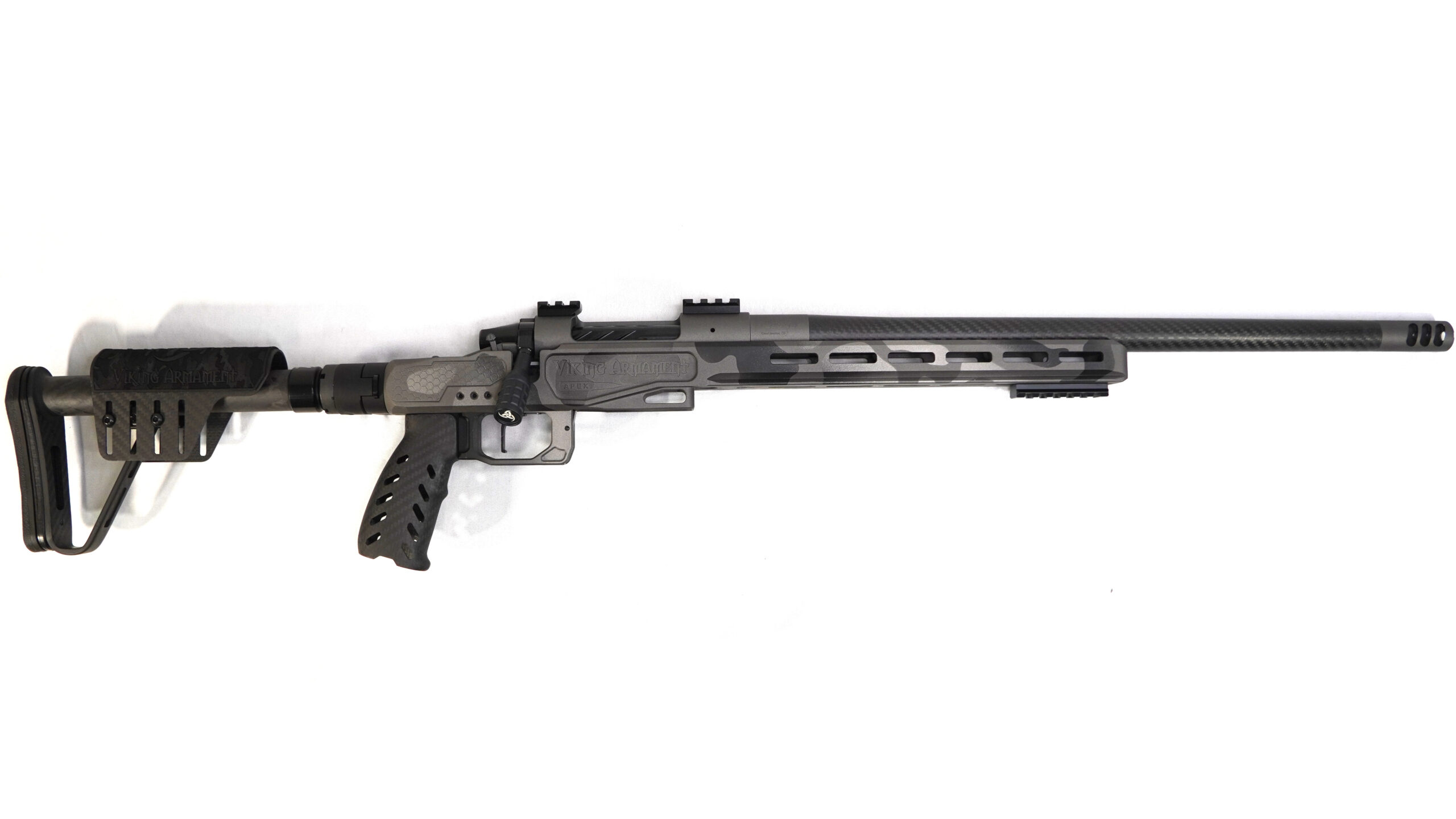 6.5 PRC CUSTOM BUILD (URBAN SAFARI) Built for hunters and shooters who want a lightweight rifle without sacrificing precision, this 6.5 PRC custom build delivers a balanced combination of performance, durability, and refined handling. Designed around the Viking Armament Outlaw action and a premium carbon-forward setup, this rifle is optimized for backcountry hunting and extended-range shooting. At just 6 lbs 11.1 oz, it remains highly portable while maintaining the stability needed for consistent, repeatable accuracy. Component Breakdown Action: Viking Armament Outlaw (VAOL) Chassis: Element 4.0 (Viking Armament Edition – Magnesium) Barrel: 20” Benchmark Barrel (6.5 PRC) Trigger: TriggerTech Special (TTS) Furniture: Carbon Fiber Components (Grip, Buttstock, Folding Adapter) Finish: Urban Safari Cerakote Performance & Application The 6.5 PRC is widely regarded for its flat trajectory and efficient long-range performance, making it a top choice for hunters targeting medium to large game at distance. Paired with a 20” Benchmark barrel, this rifle delivers consistent velocity and excellent shot-to-shot reliability while maintaining a lightweight profile. The magnesium Element 4.0 chassis provides a rigid, stable shooting platform without unnecessary weight, while the carbon fiber components further reduce carry fatigue during long hunts. This combination results in a rifle that is easy to pack, quick to handle, and dependable in demanding environments. The TriggerTech Special ensures a crisp, repeatable break, giving shooters full control over every shot. Finished in Urban Safari Cerakote, this rifle offers a unique, durable finish that stands out while providing protection against the elements. Precision Guarantee Every Viking Armament rifle is backed by our Sub-½ MOA Accuracy Guarantee, ensuring reliable accuracy when it matters most.
