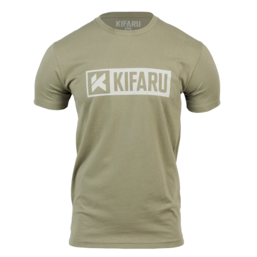 Kifaru Logo T-Shirt – Tan Show your support for one of the most trusted names in backcountry gear with the Kifaru Logo T-Shirt. Simple, rugged, and comfortable, this everyday tee carries the iconic Kifaru logo proudly across the chest — a mark recognized by serious hunters, backpackers, and adventurers who rely on Kifaru gear when it matters most. Key Features Classic Kifaru Logo – Clean front graphic featuring the unmistakable Kifaru branding. Premium Cotton Blend – Soft, breathable fabric that feels great in all-day wear. Athletic Fit – Designed for comfort and mobility without being too loose or too tight. Versatile Style – Ideal for casual wear, range days, or representing your backcountry lifestyle. Durable Print – High-quality screen printing that stands up to repeated washes. Why It Stands Out The Kifaru Logo Tee isn’t just a shirt — it’s a badge of loyalty to a company built on performance, durability, and real-world experience in the field. Lightweight yet durable, it’s equally at home on the mountain, around camp, or as your go-to casual shirt. The tan color makes it versatile, easy to pair with any gear, and subtle enough for everyday wear while still showing your connection to the Kifaru community. Specs Material: Cotton/poly blend Color: Tan Fit: Regular/Athletic The Kifaru Logo T-Shirt – Tan is more than casual wear — it’s a statement of the lifestyle you live and the gear you trust.